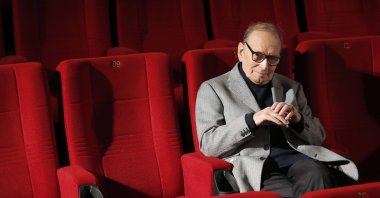 Italian composer Ennio Morricone poses during a photo call to promote his German 2014 concerts, in Berlin, Germany, Dec. 6, 2013. (AP Photo)