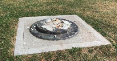 This photo provided by WROC-TV shows the remnants of a Frederick Douglass statue ripped from its base at a park in Rochester, New York, July 5, 2020. (AP Photo)