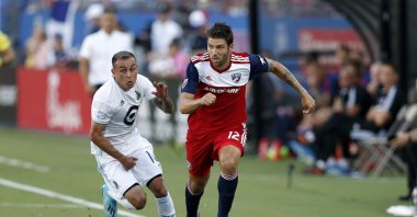 FC Dallas' Ryan Hollingshead dribbles past Minnesota United's Miguel Ibarra during an MLS match in Frisco, Texas, U.S., Aug. 10, 2019. (AP Photo)
