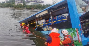 Rescue workers are seen at the site where a bus carrying students plunged into a reservoir, in Anshun, Guizhou province, China, July 7, 2020. (China Daily Photo via Reuters)