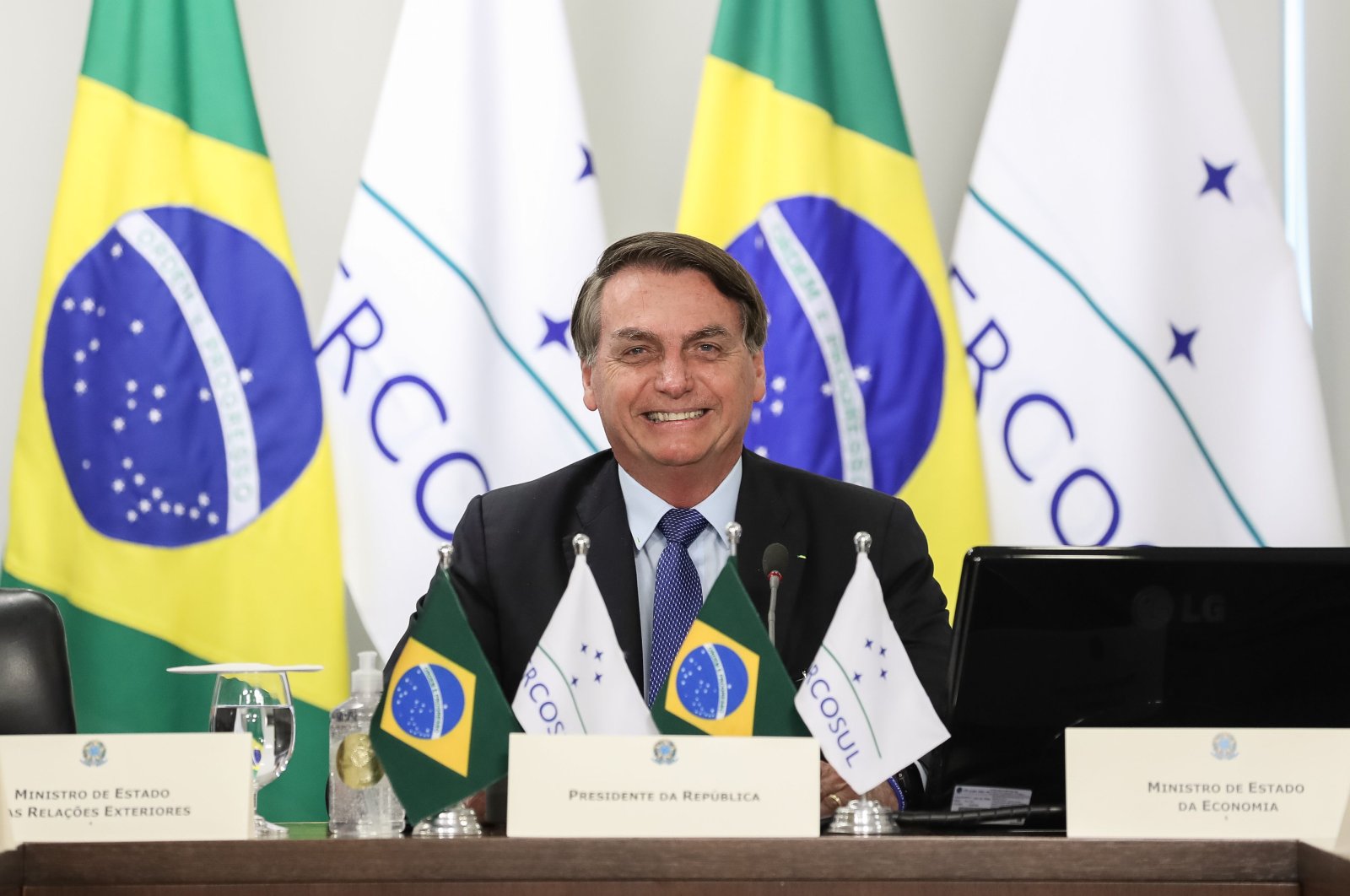 Brazilian President Jair Bolsonaro smiles during the first Mercosur Summit held via videoconference due to the coronavirus pandemic, Brazil, July 2, 2020. (AFP Photo)