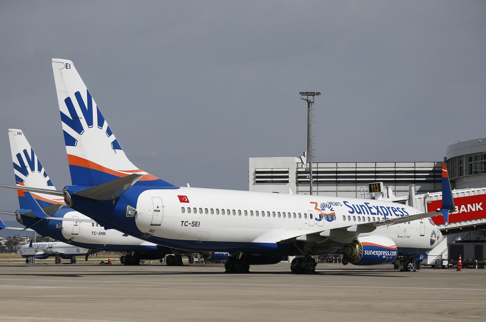 In this file photo, SunExpress planes sit parked at the gate of the Antalya Airport in Antalya, Turkey. (AA Photo) 