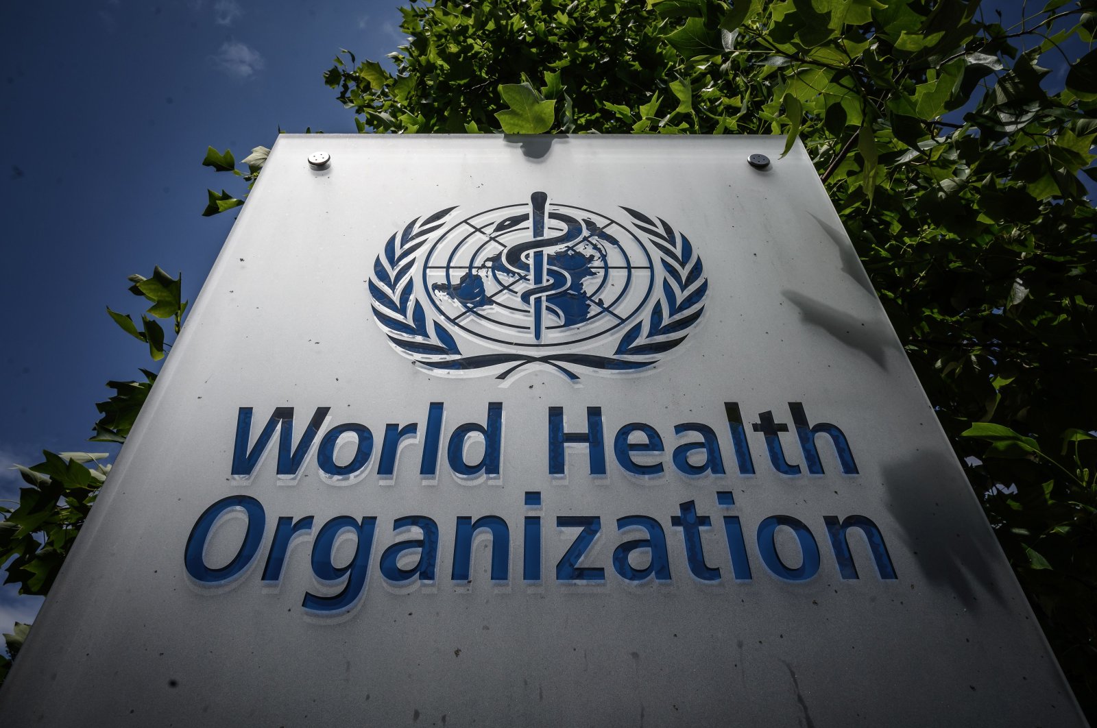 A sign of the World Health Organization (WHO) at their headquarters in Geneva, amidst the COVID-19 outbreak, caused by the novel coronavirus, July 3, 2020. (Photo by Fabrice COFFRINI / AFP)