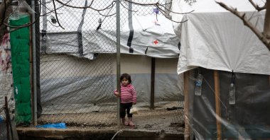 A girl stands among makeshift shelters at a camp for refugees and migrants next to the Moria camp, on the island of Lesbos, Greece, March 9, 2020. (Reuters Photo)