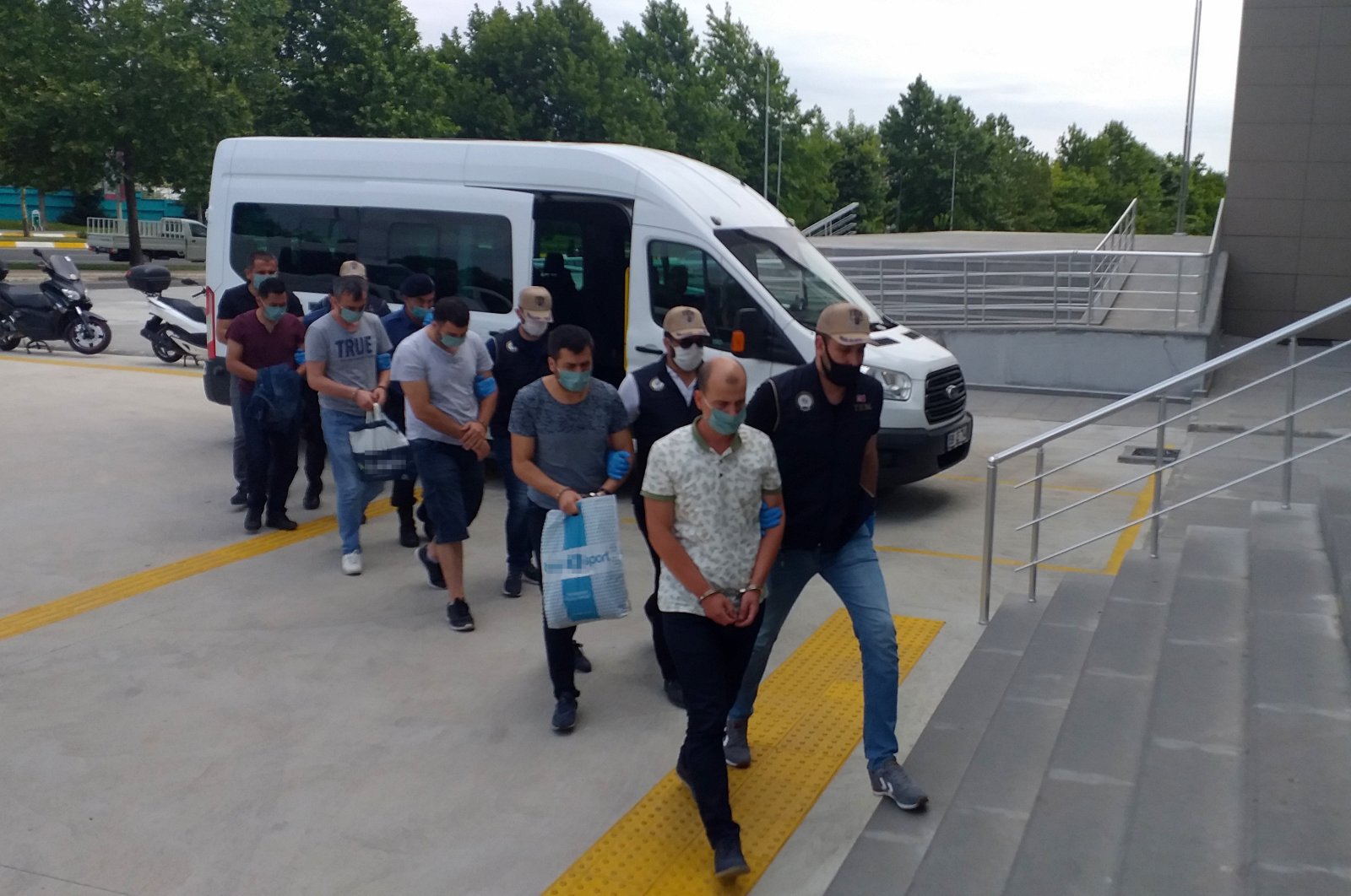 Police escort FETÖ suspects to the courthouse after an operation in Tekirdağ, Turkey, July 8, 2020. (IHA Photo)