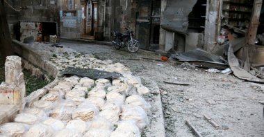 Stacks of bread are seen at a damaged site after an airstrike in the opposition-held Bab al-Maqam neighborhood of Aleppo, Syria, Sept. 28, 2016. (Reuters Photo)