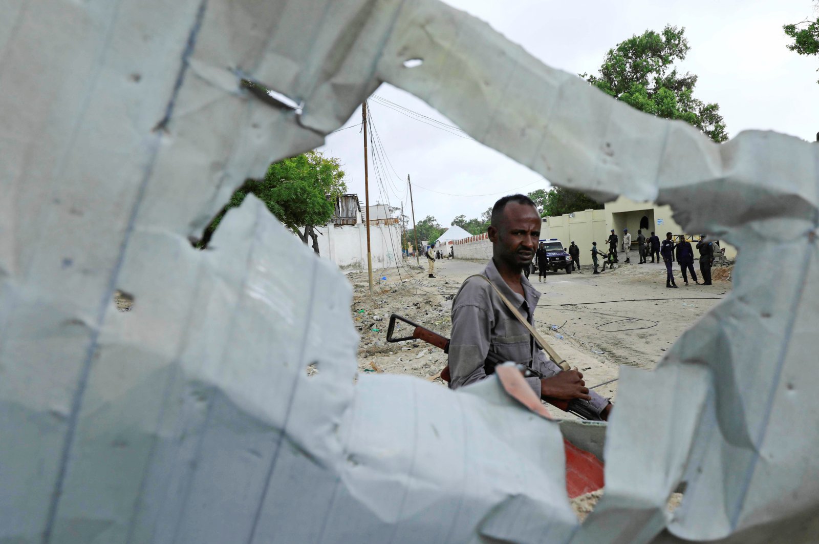 A Somali policeman walks at the crime scene after a suicide car bomber drove into a checkpoint outside the port in Mogadishu, Somalia, July 4, 2020. (Reuters Photo)
