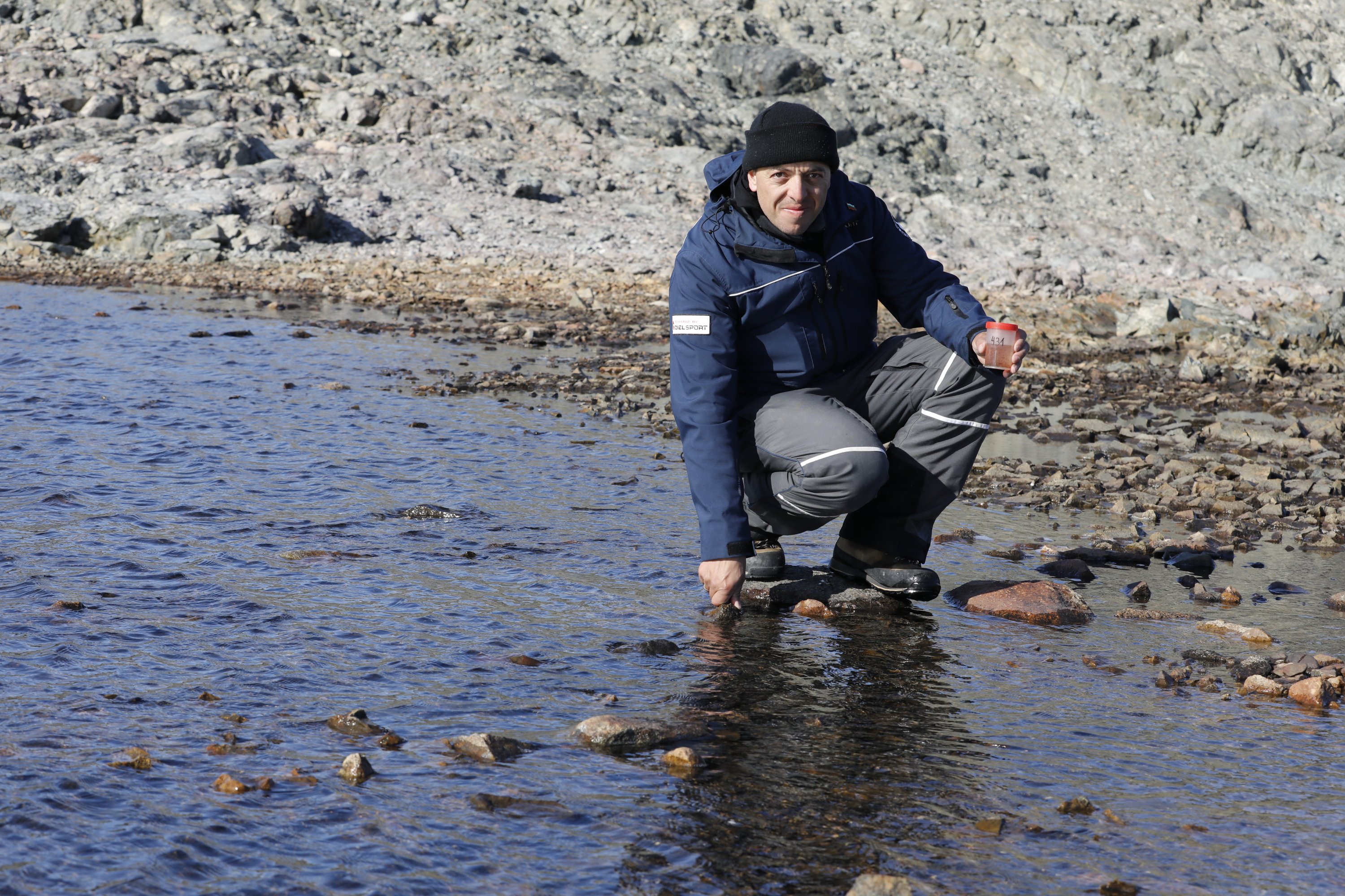 Bulgarian scientist Lyubomir Kenderov collects water samples from the Antarctic. (Photo by Hayrettin Bektaş)