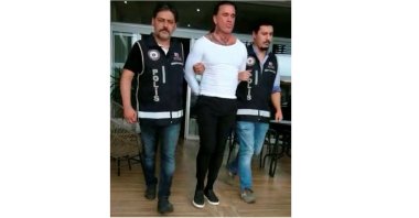 Arabacı being arrested by Turkish police in Izmir's Çeşme, July 10, 2020. (AA Photo)