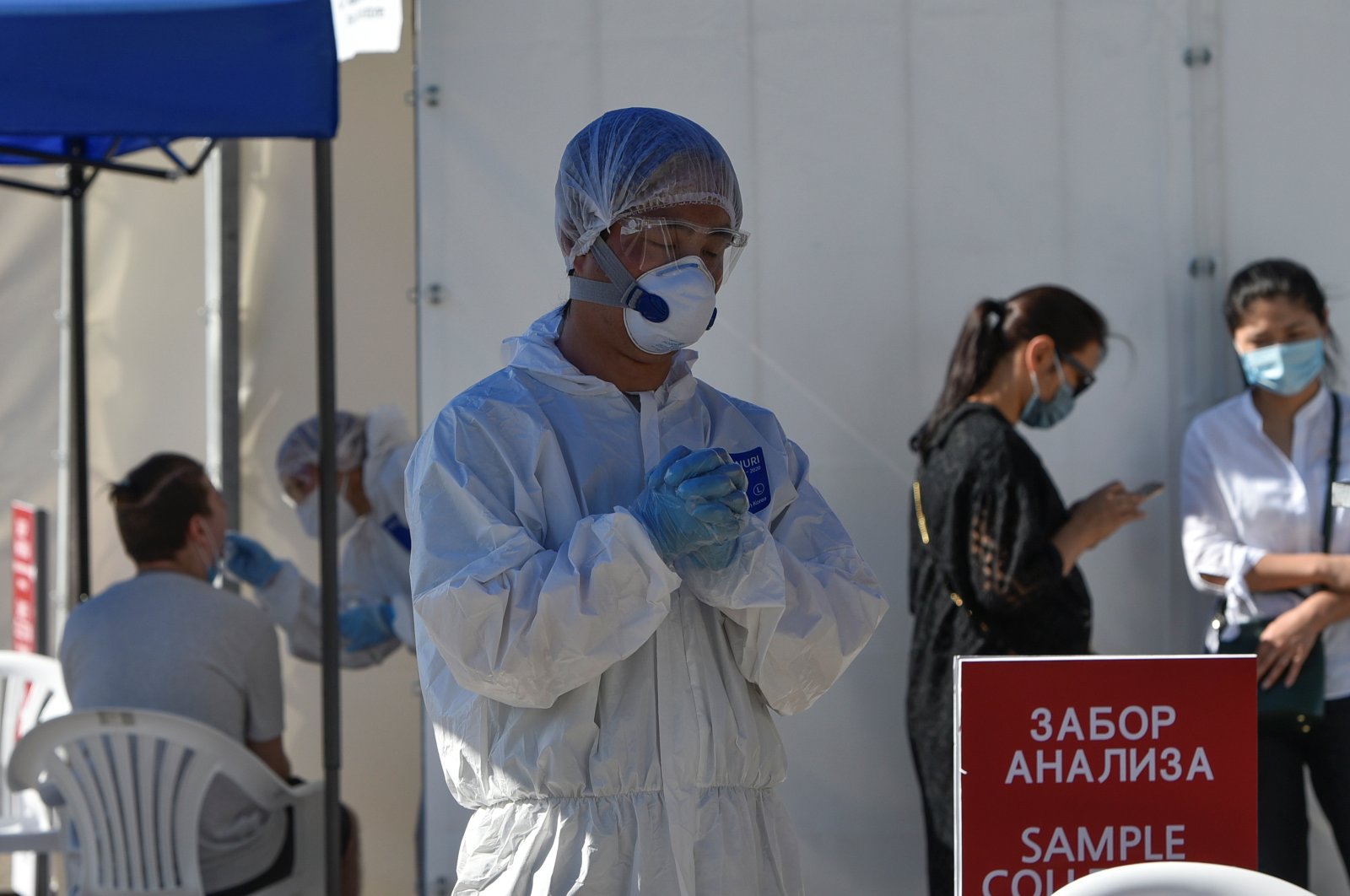 Medical specialists wearing protective equipment work at the coronavirus disease testing facility, Almaty, July 8, 2020. (REUTERS Photo)