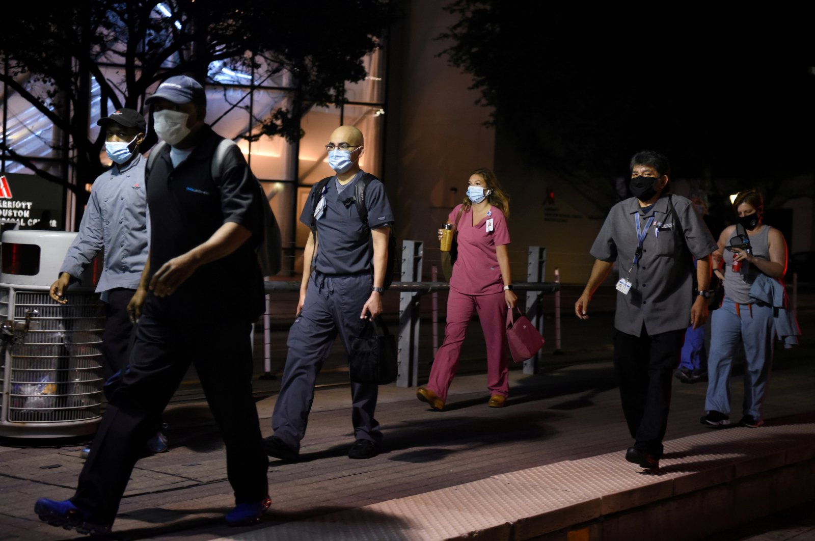 Health care workers walk through the Texas Medical Center during a shift change as cases of the coronavirus spike, Houston, Texas, July 8, 2020. (REUTERS Photo)