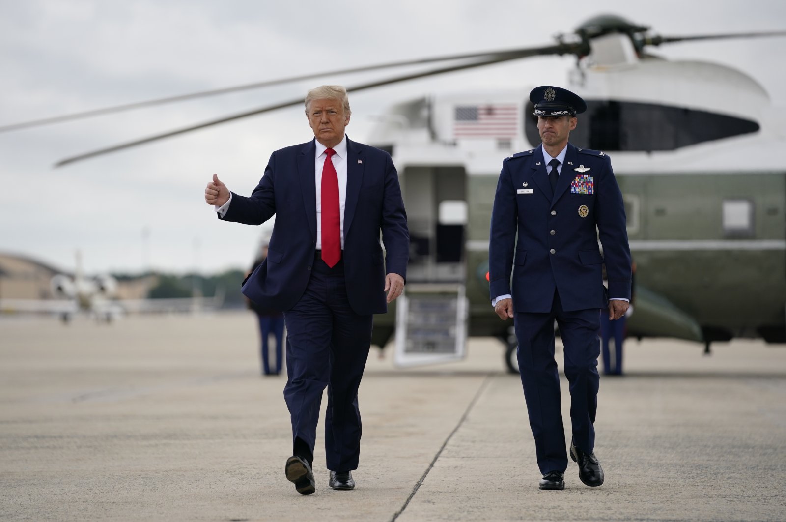 President Donald Trump gestures as he walks from Marine One to board Air Force One for a trip to Florida, in Maryland, United States, July 10, 2020. (AP Photo) 