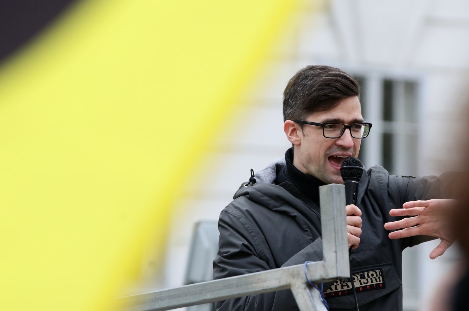 Leader of Austria's far-right Identitarian Movement Martin Sellner speaks during a protest against a police raid at his house, outside the Justice Ministry in Vienna, Austria, April 13, 2019. (Reuters Photo)