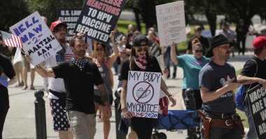 Ignoring social distancing and mandates to wear masks, protesters attend an "Open Texas" rally at the Texas State Capitol, April 25, 2020, in Austin. (AP Photo)