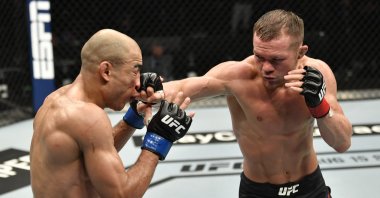 Petr Yan punches Jose Aldo in their UFC bantamweight championship fight on UFC Fight Island, Abu Dhabi, UAE, July 12, 2020. (Reuters Photo)