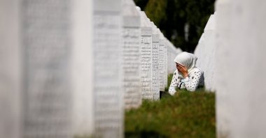A woman cries at a graveyard ahead of a mass funeral in Potocari near Srebrenica, Bosnia and Herzegovina, July 11, 2020. (Reuters Photo)