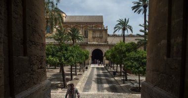 A tourist visits the Patio de los Naranjos (Garden of oranges) at The Mezquita (mosque) in Cordoba after restrictions were lifted following a national lockdown put in place to fight the coronavirus pandemic, Cardoba, Spain, July 8, 2020. (AFP Photo)