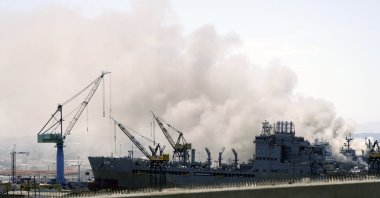Smoke rises from a fire on board the U.S. Navy amphibious assault ship USS Bonhomme Richard at Naval Base San Diego, California, U.S., July 12, 2020. (Reuters Photo)