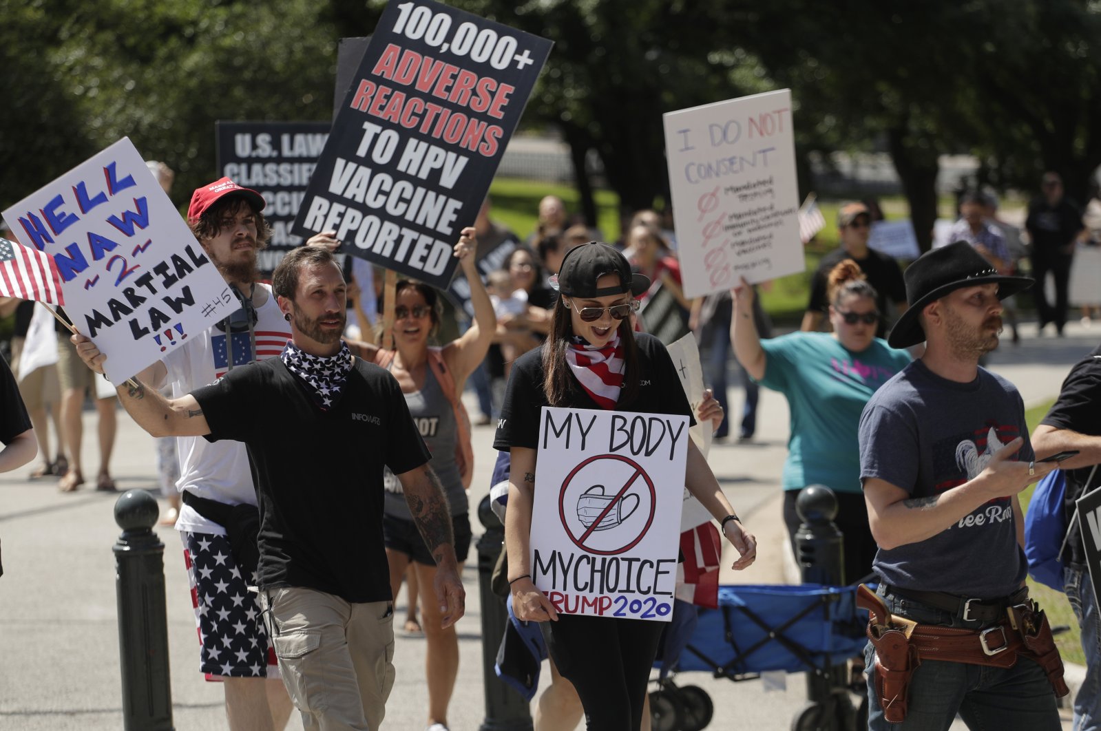 Ignoring social distancing and mandates to wear masks, protesters attend an "Open Texas" rally at the Texas State Capitol, April 25, 2020, in Austin. (AP Photo)