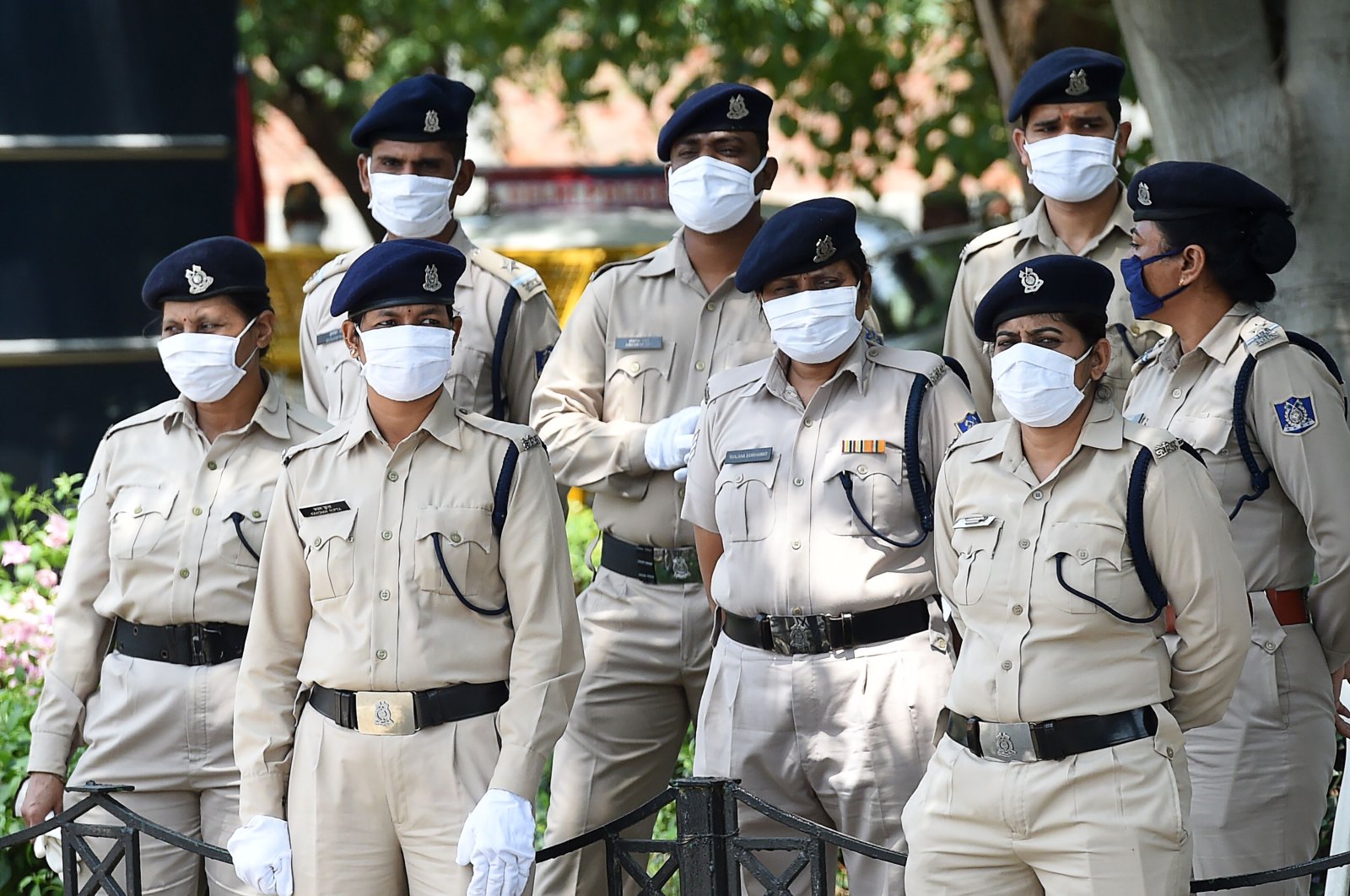 Indian security personnel stand guard as Tibetan Youth Congress (TYC) activists stage a protest against China in support of India outside the Chinese embassy in New Delhi, July 11, 2020. (AFP Photo)