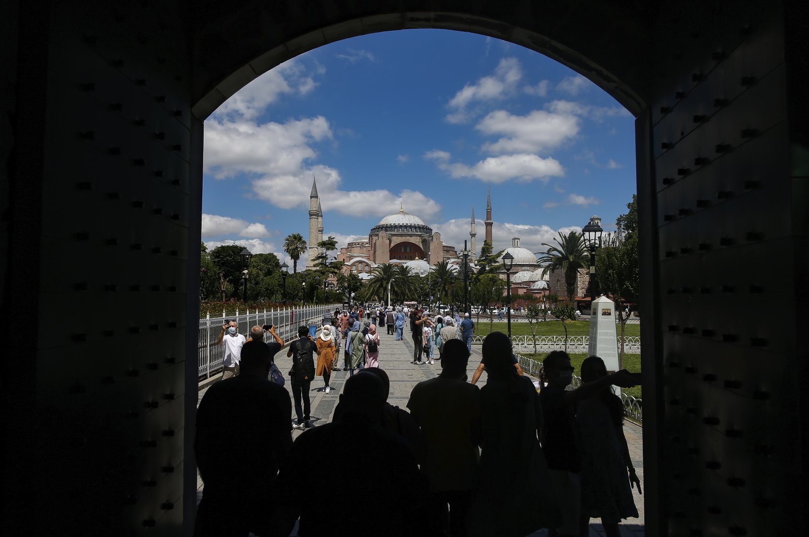 People walk toward the Hagia Sophia, one of Istanbul's main tourist attractions in the historic Sultanahmet district of Istanbul, July 11, 2020. (AP Photo)