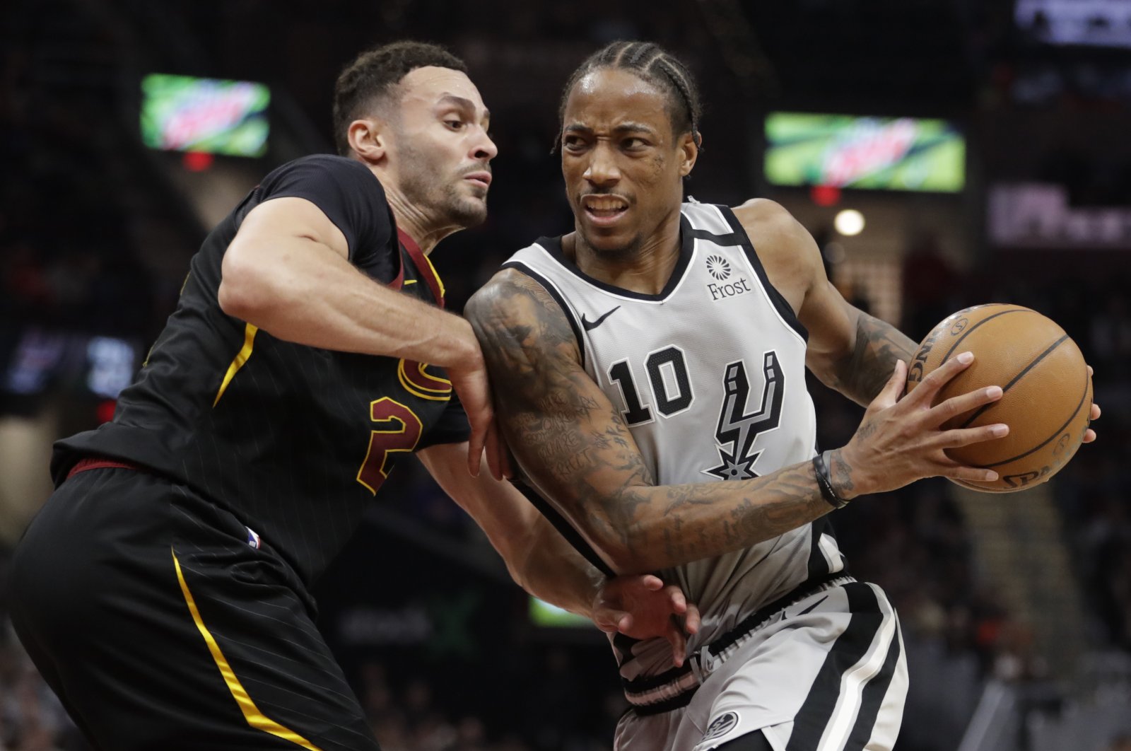 San Antonio Spurs' DeMar DeRozan (10) drives past Cleveland Cavaliers' Larry Nance Jr. (22) during an NBA game in Cleveland, U.S., March 8, 2020. (AP Photo)