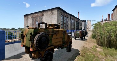 This screenshot from the video game ARMA 3 shows the Turkish-built armored vehicle, Kirpi. 