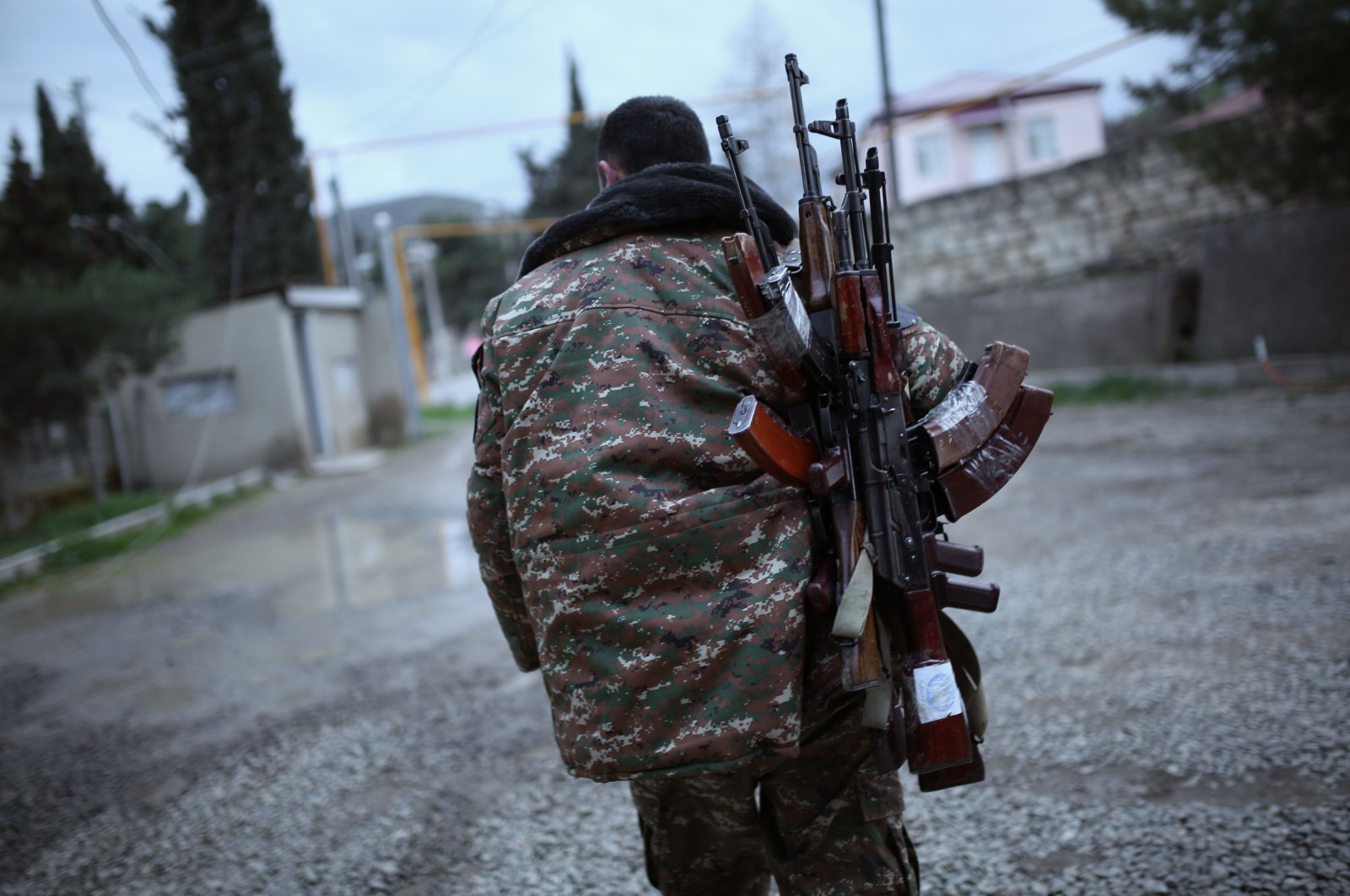 In this file photo taken on April 4, 2016, a soldier of the self-defence army of Nagorno-Karabakh carries weapons in the Martakert region. (AFP Photo)