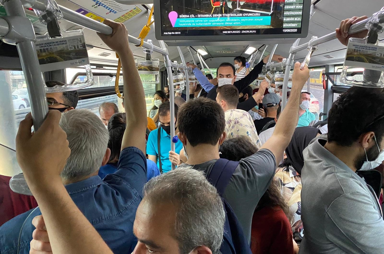People travel in a metrobus, in Istanbul, Turkey, June 15, 2020. (IHA Photo) 