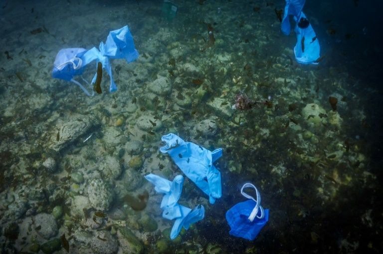 Researchers found disposable masks and gloves used as a protection against COVID-19 in rivers across Europe. (AFP Photo)