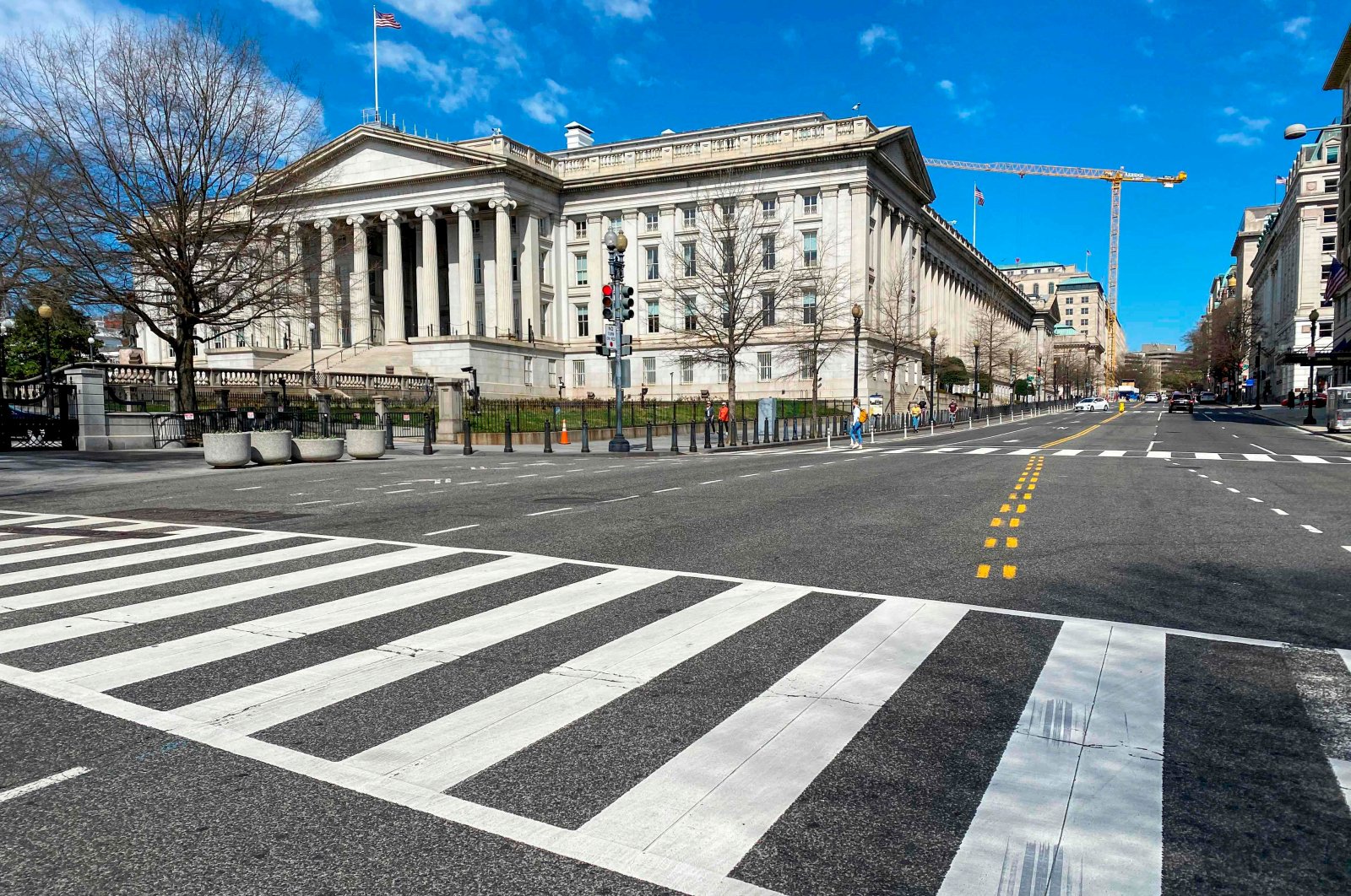 The U.S. Treasury Department building is seen next to an almost empty 15th Street at noon in Washington D.C., U.S., March 13, 2020. (AFP Photo)