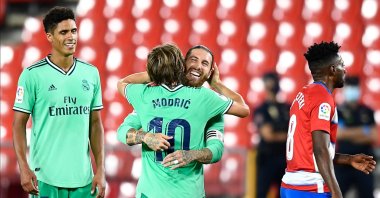 Real Madrid's Sergio Ramos (2nd R) celebrates his team's victory with his teammate Luka Modric during the La Liga match against Granada in Granada, Spain, July 13, 2020. (AP Photo)