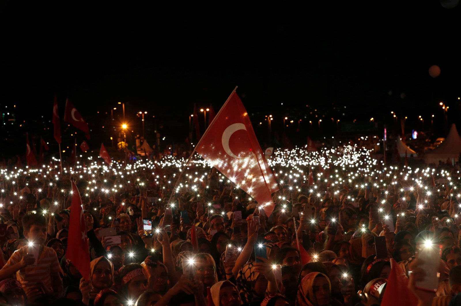 People attend a ceremony marking the second anniversary of the attempted coup at the July 15 Martyrs Bridge in Istanbul, Turkey, July 15, 2018. (Reuters Photo)