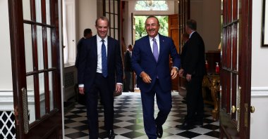 British Foreign Secretary Dominic Raab (L) and his Turkish counterpart Mevlüt Çavuşoğlu walk at Carlton Gardens ahead of a meeting in London, July 8, 2020. (AFP Photo)
