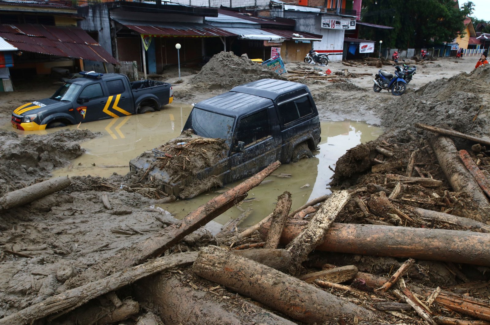 Flash floods hit Indonesia, killing at least 21, displacing hundreds ...