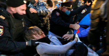 Police officers detain a protester during a rally to cancel the results of voting on amendments to the Constitution in Pushkin Square in Moscow, Russia, July 15, 2020. (AP Photo)