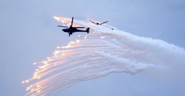 Taiwan's AH-64E Apache attack helicopter launches flares during the 36th Han Kung military exercises in Taichung City, central Taiwan, July 16, 2020. (AP Photo)