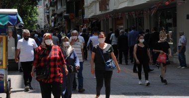 People wearing masks against the coronavirus walk on the street, in Eskişehir, Turkey, July 14, 2020. (IHA Photo)