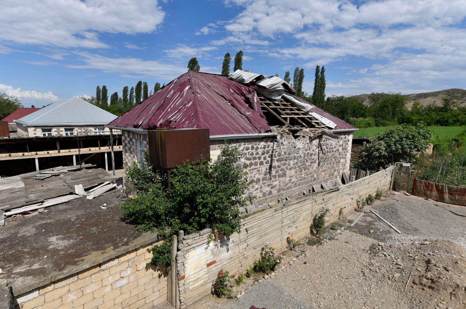 A damaged house is seen after shelling by Armenian forces in the Tovuz region of Azerbaijan, Tuesday, July 14, 2020. (AP Photo)