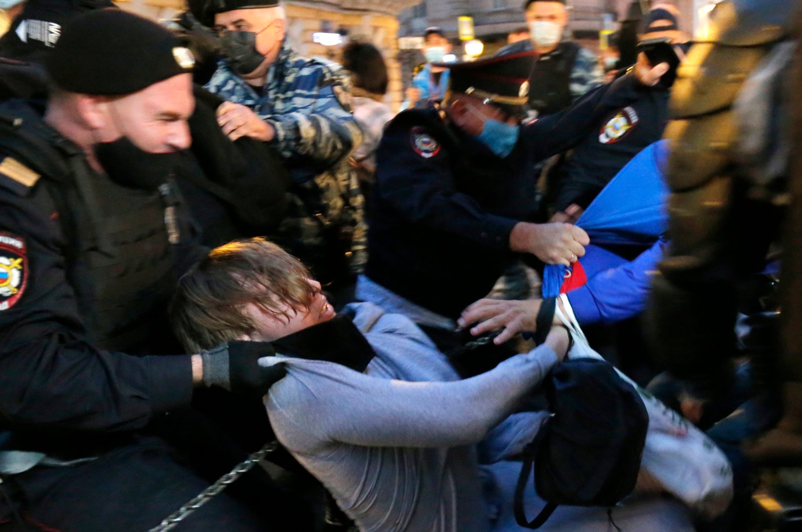 Police officers detain a protester during a rally to cancel the results of voting on amendments to the Constitution in Pushkin Square in Moscow, Russia, July 15, 2020. (AP Photo)