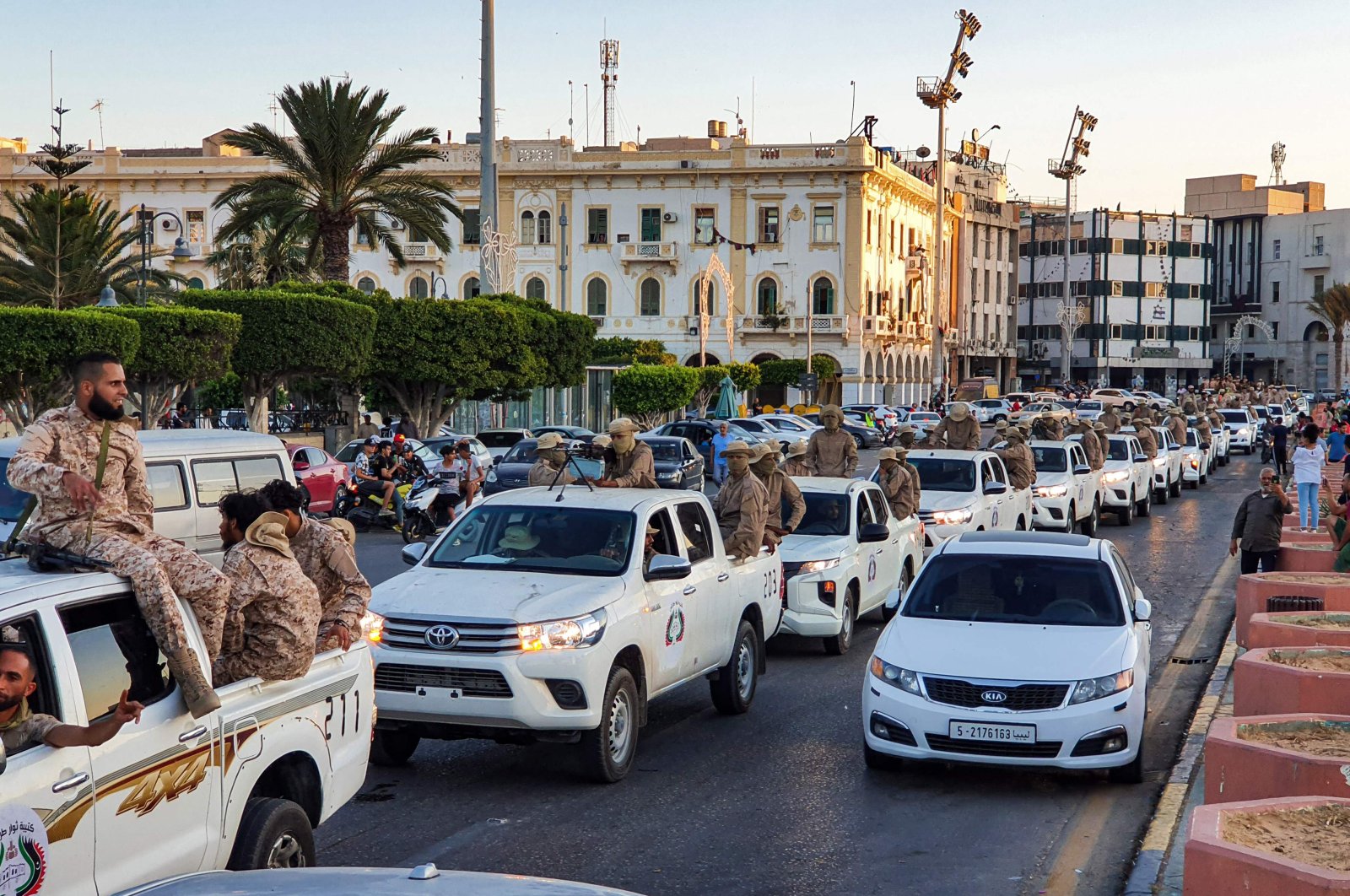 Vehicles of the "Tripoli Brigade", a group loyal to the UN-recognised Government of National Accord (GNA), parade through the Martyrs' Square at the centre of the GNA-held Libyan capital Tripoli, July 10, 2020. (AFP)
