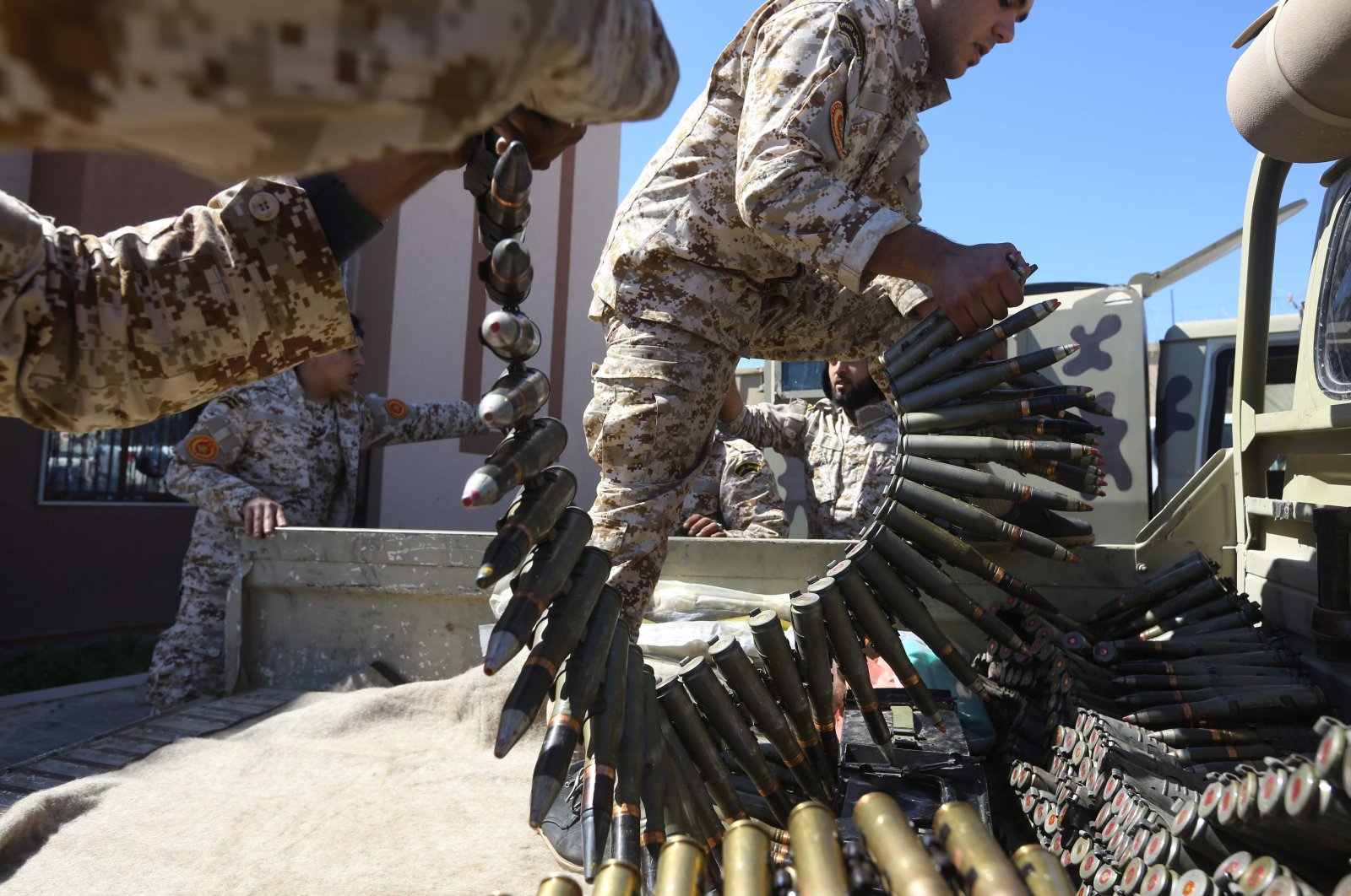 Fighters from a Misrata armed group loyal to the internationally recognised Libyan Government of National Accord (GNA) prepare their ammunition before heading to the frontline as battles against Khalifa Haftar, in Tripoli, April 8, 2019. (AFP)