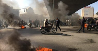 Iranian protesters rally amid burning tires during a demonstration against an increase in gasoline prices, Isfahan, Iran, Nov. 16, 2019. (AFP Photo)
