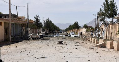 Afghan security personnel inspect the site of a car bomb blast on an intelligence compound, Aybak, Afghanistan, July 13, 2020. (AP Photo)