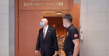 Nazmi Mete Cantürk (L) leaves the courtroom, in Istanbul, Turkey, July 17, 2020. (AA Photo) 