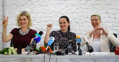 Maria Kolesnikova, a representative of Viktor Babariko (R), Svetlana Tikhanovskaya, candidate for the presidential elections (C), and wife of non-registered candidate Valery Tsepkalo, Veronika Tsepkalo, gestures during a news conference in Minsk, Belarus, July 17, 2020. (AP Photo)