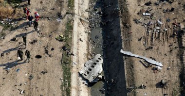 In this Jan. 8, 2020 file photo, rescue workers search the scene where a Ukrainian plane crashed in Shahedshahr, southwest of Tehran, Iran.  (AP Photo)