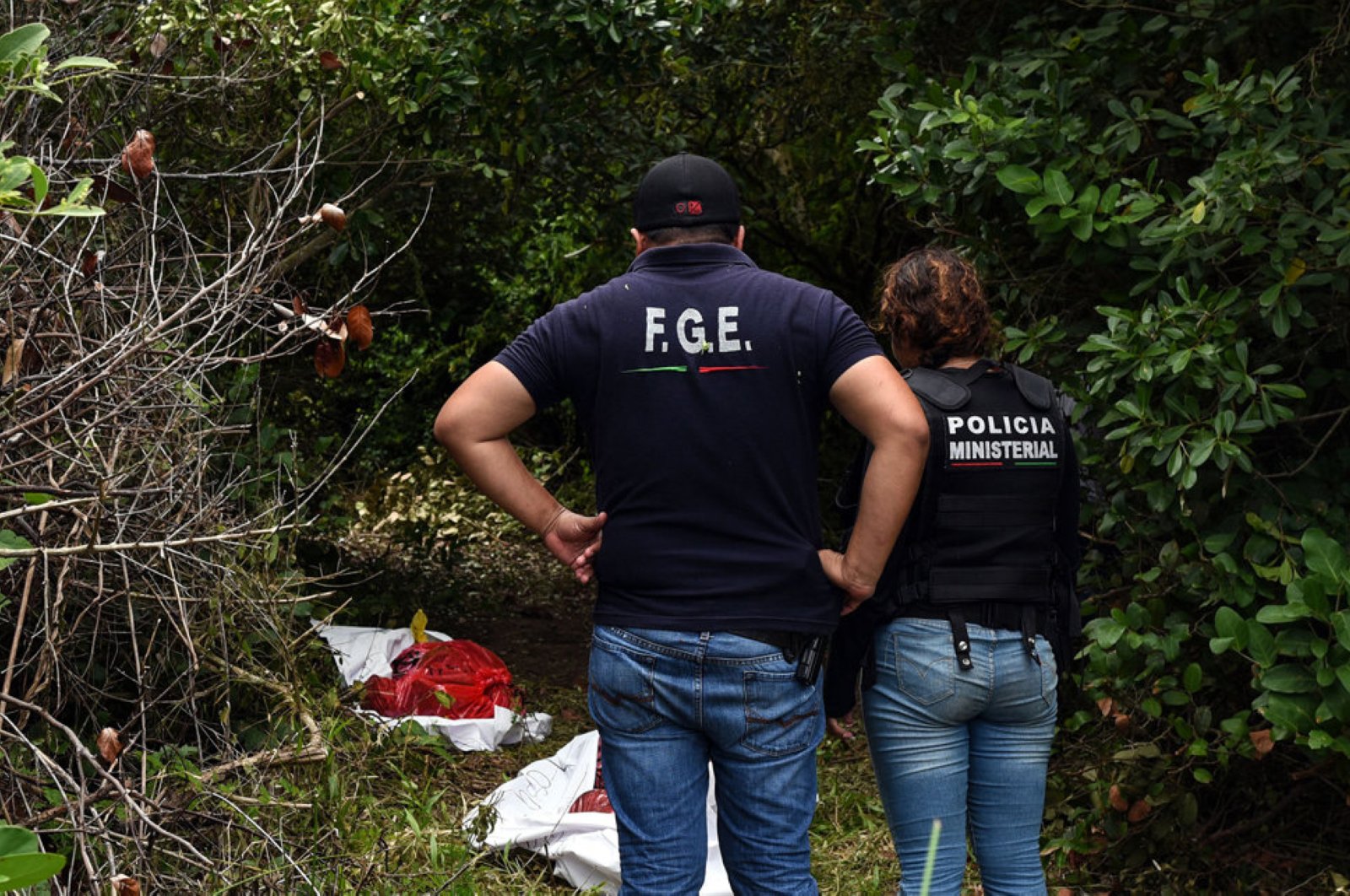 Ministerial police officers work at the site of a mass grave, where at least 166 bodies were discovered since exhumations began on August 8, at  Alvarado municipality in the Mexican southeastern state of Veracruz on September 07, 2018. (AFP Photo)