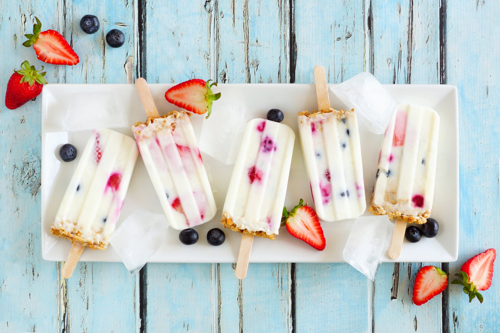 You could either blend in the fruit or keep them whole in your yogurt popsicles. (iStock Photo)