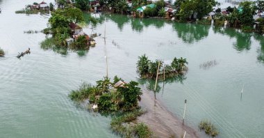 This aerial view shows flooded houses in Sunamganj, Bangladesh on July 15, 2020. (AFP Photo)